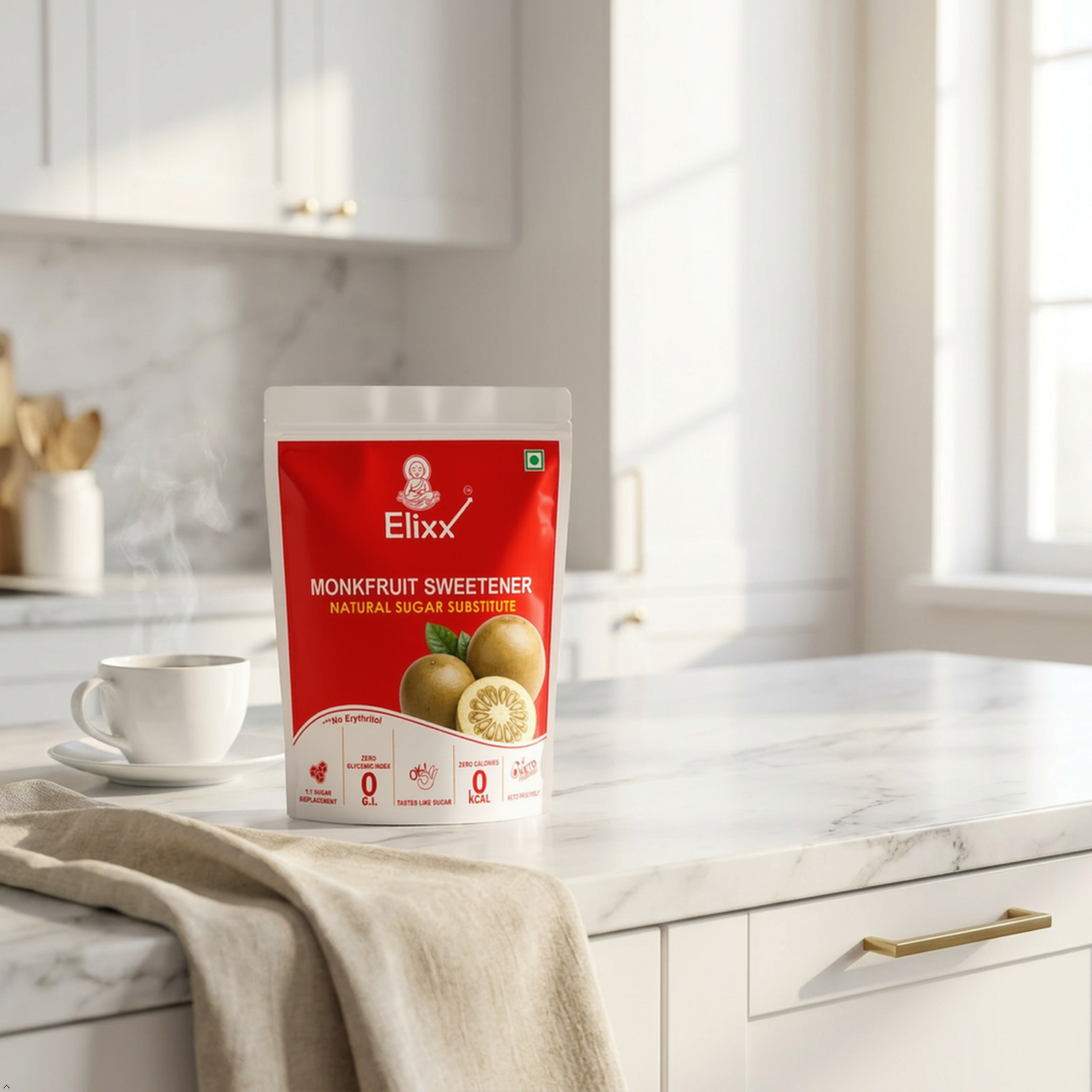A stand-up pouch of ElixX Monkinfruit Sweetener stands on a white marble kitchen countertop with a white cup and saucer beside it.
